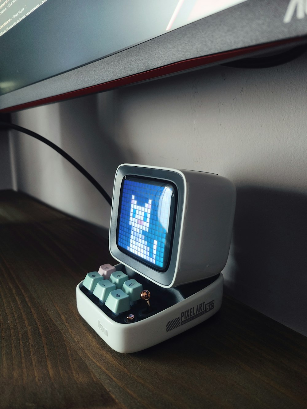 an old computer sitting on top of a wooden table