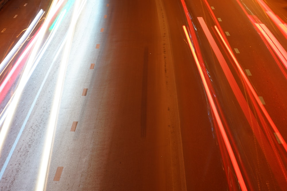 a street filled with lots of traffic next to a tall building