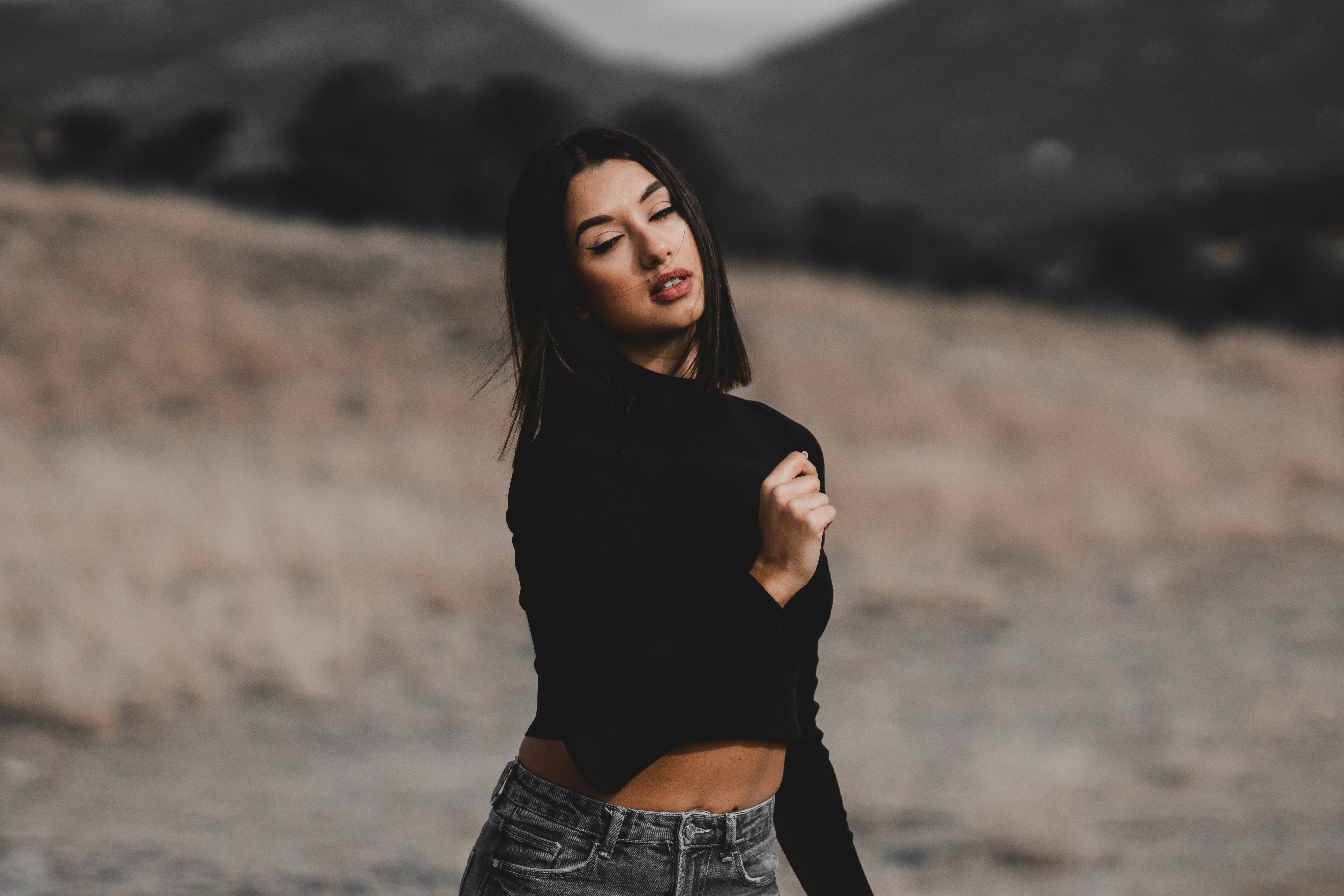 Woman working on content creation with female AI model on screen