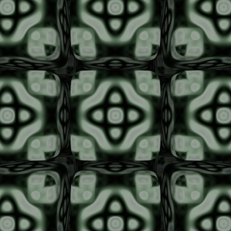 A geometric, symmetrical pattern featuring abstract shapes and recurring motifs. The design is composed of rounded, cross-like forms and circular elements, creating a kaleidoscopic effect. The overall look is intricate, with a soothing blend of colors that appear soft and muted.