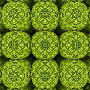 A pattern of green, textured, cube-like shapes arranged in a grid. Each shape has intricate symmetrical detailing that resembles a mandala or kaleidoscope pattern.