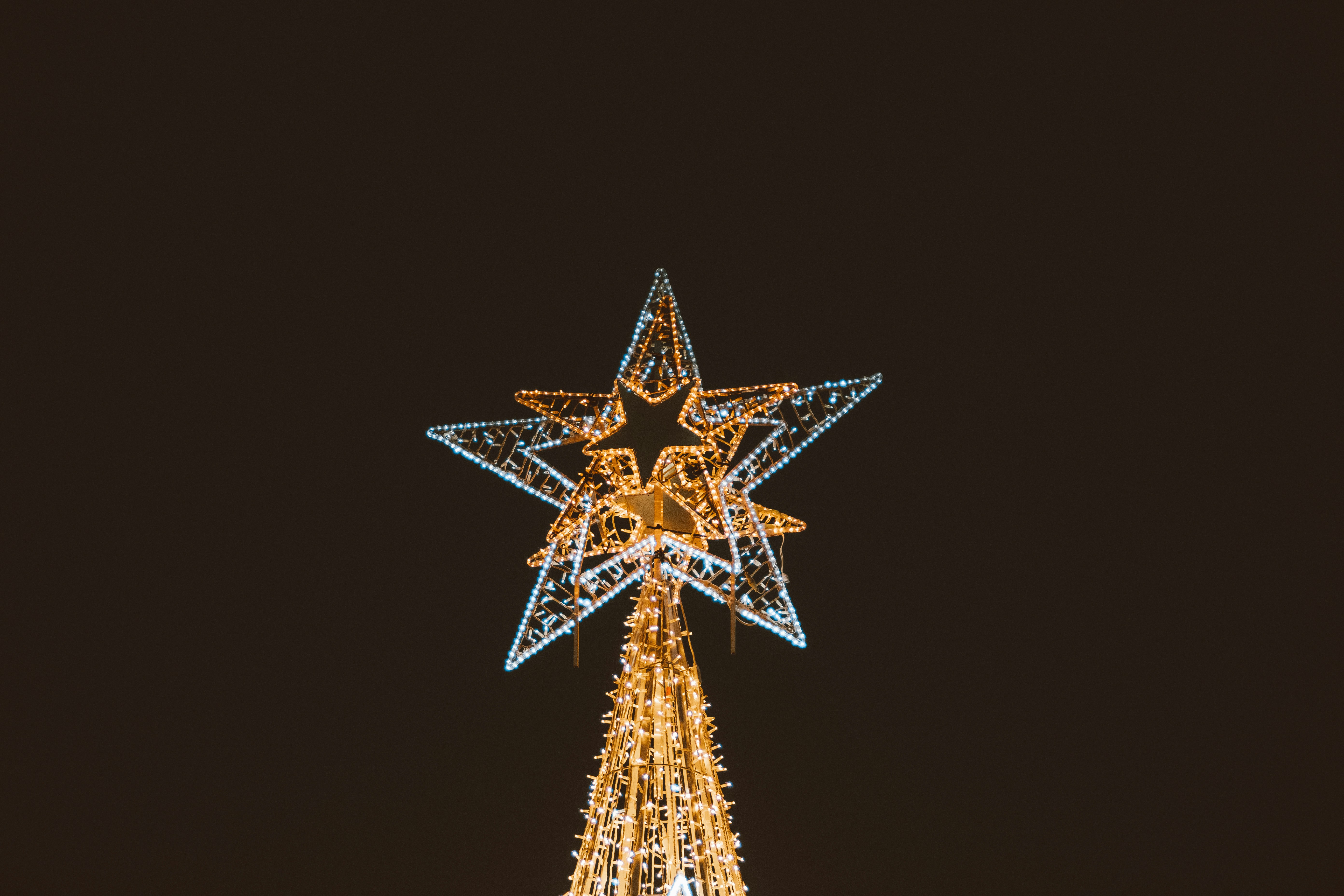 a lighted christmas tree with a star on top