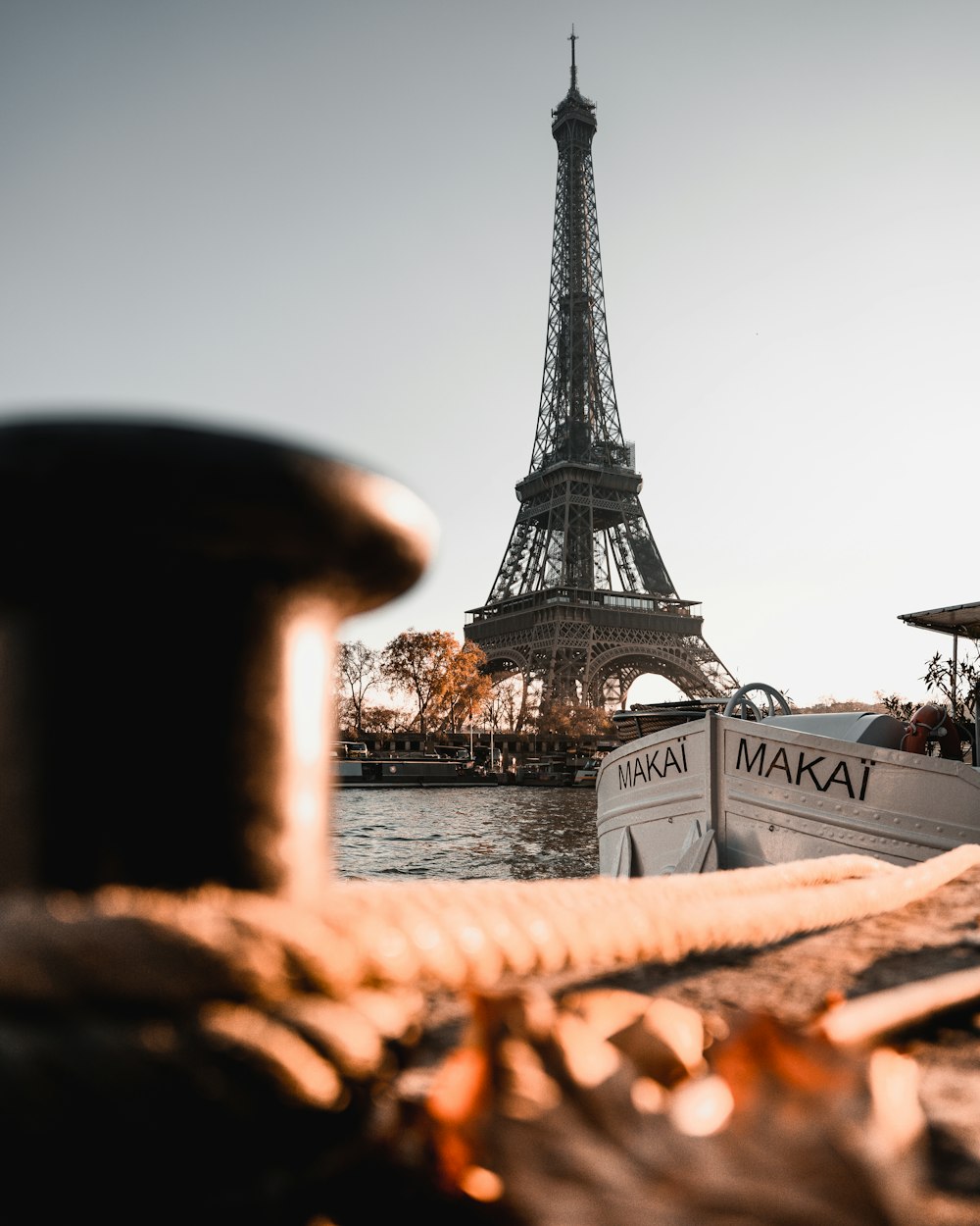 a boat is docked in front of the eiffel tower