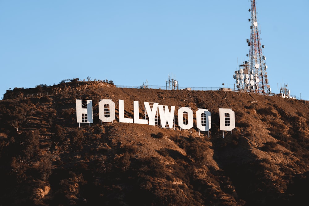 the hollywood sign is covered in dirt on top of a hill