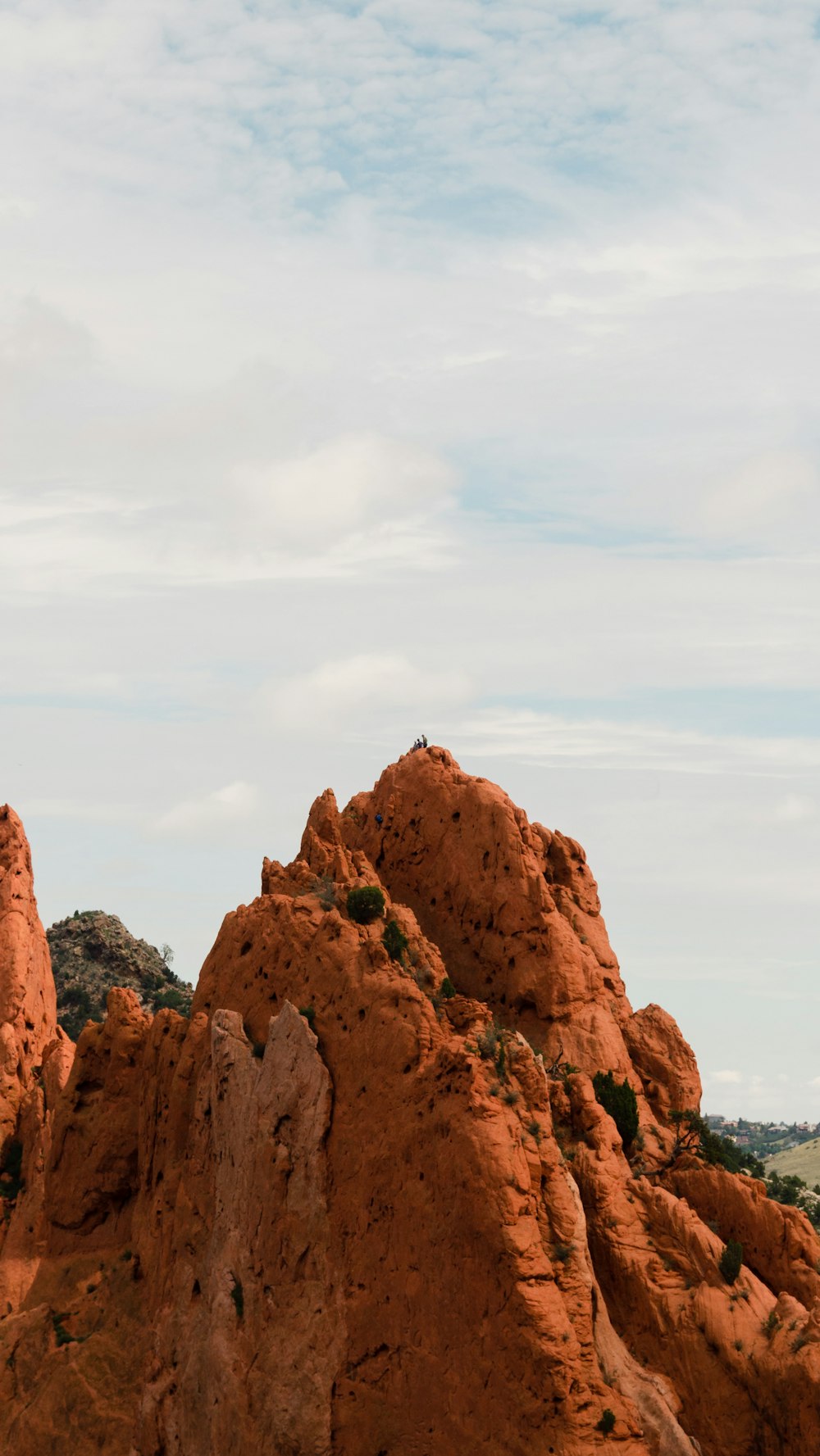 a large rock formation in the middle of a desert