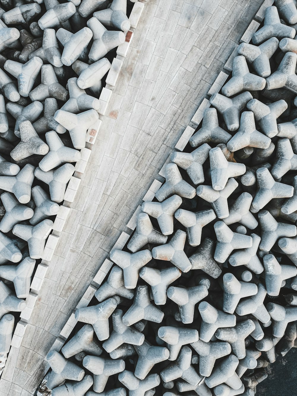 an aerial view of a walkway made of cement blocks