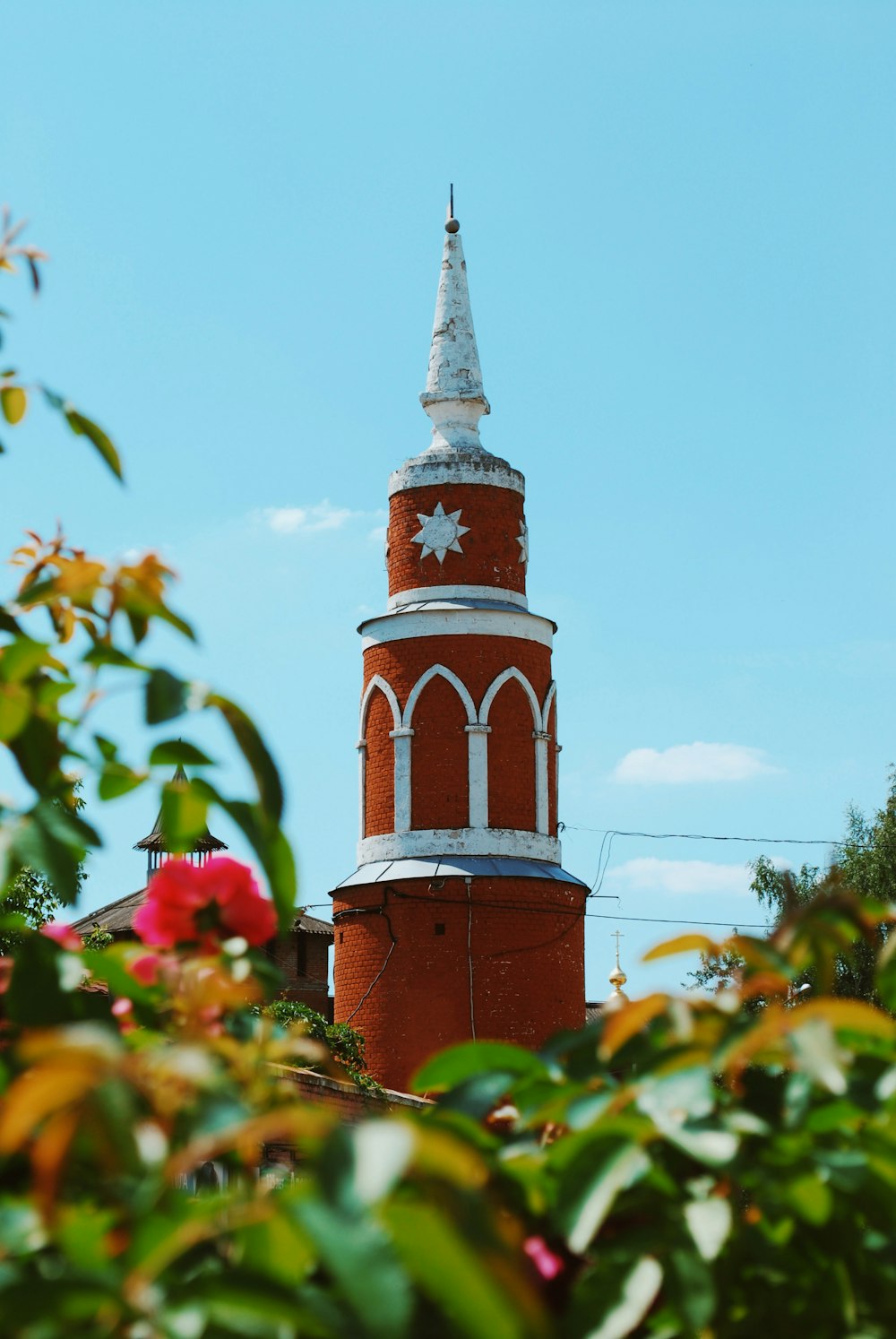 a tall tower with a clock on the top of it