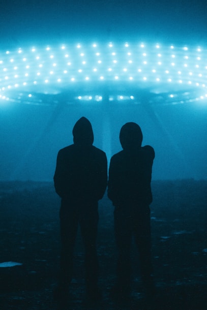 a couple of people standing in front of a stadium