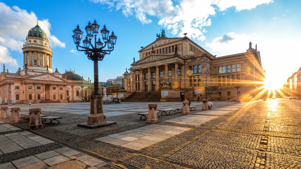 the sun shines brightly on a city square