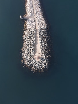 Engineers inspecting a retrofitted breakwater for energy generation.