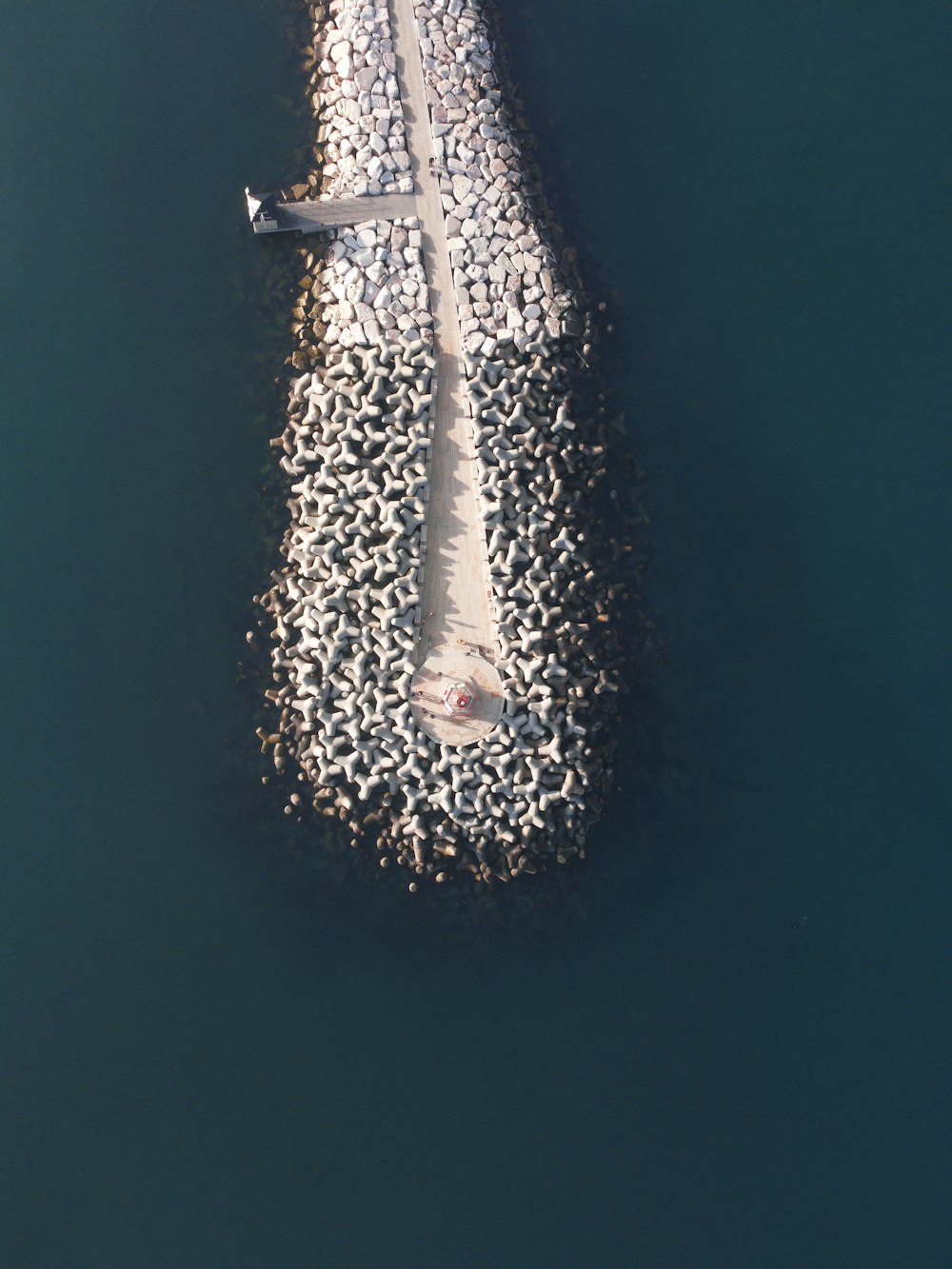 an aerial view of a boat in a body of water