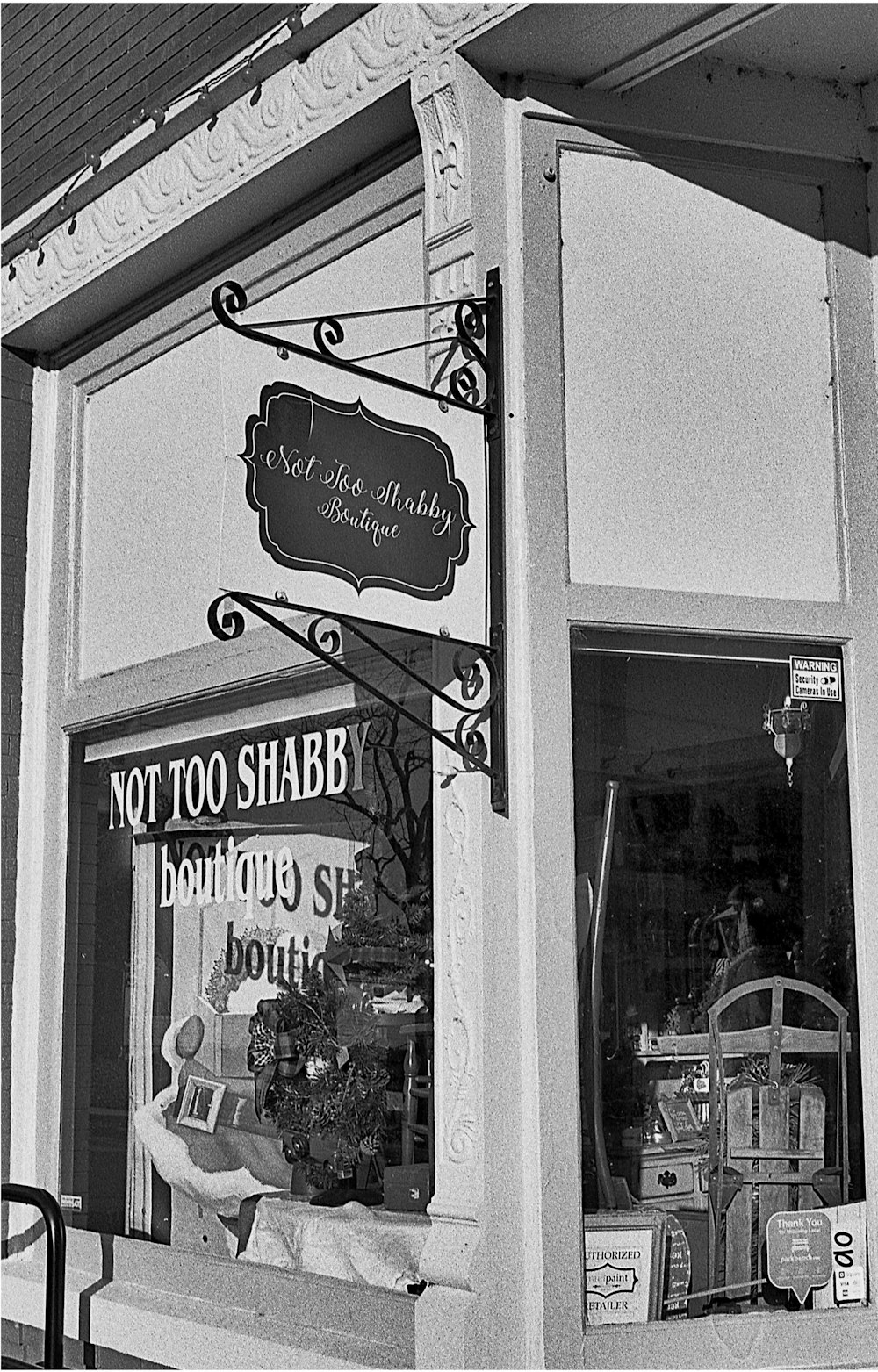 a black and white photo of a store front