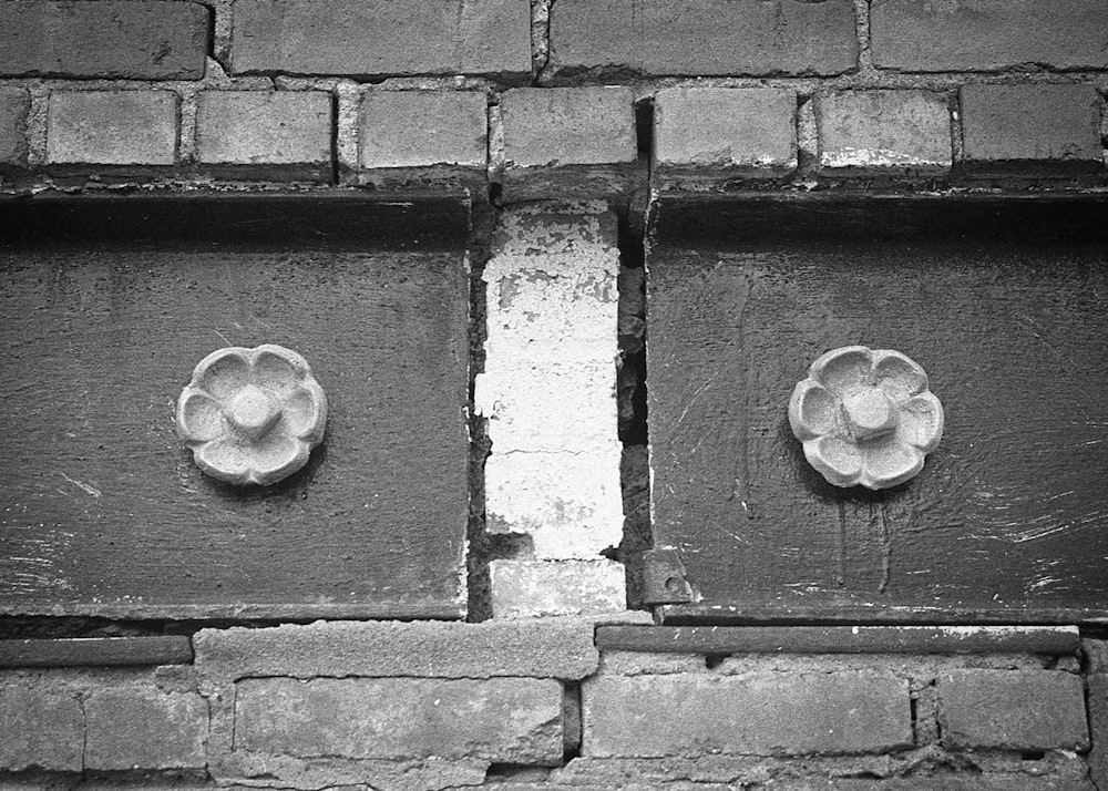 a black and white photo of a brick wall