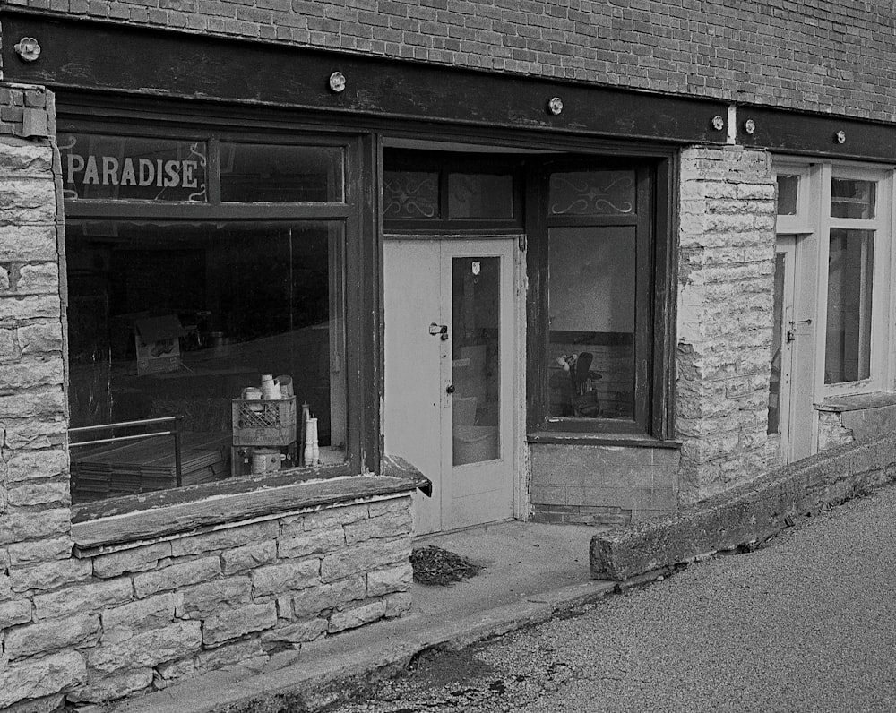 a black and white photo of a store front