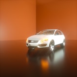 A sleek white car is positioned in a minimalist setting with a glossy floor and warm orange walls. The lighting emphasizes the car's smooth contours and reflective surface, creating a futuristic and stylish ambiance.