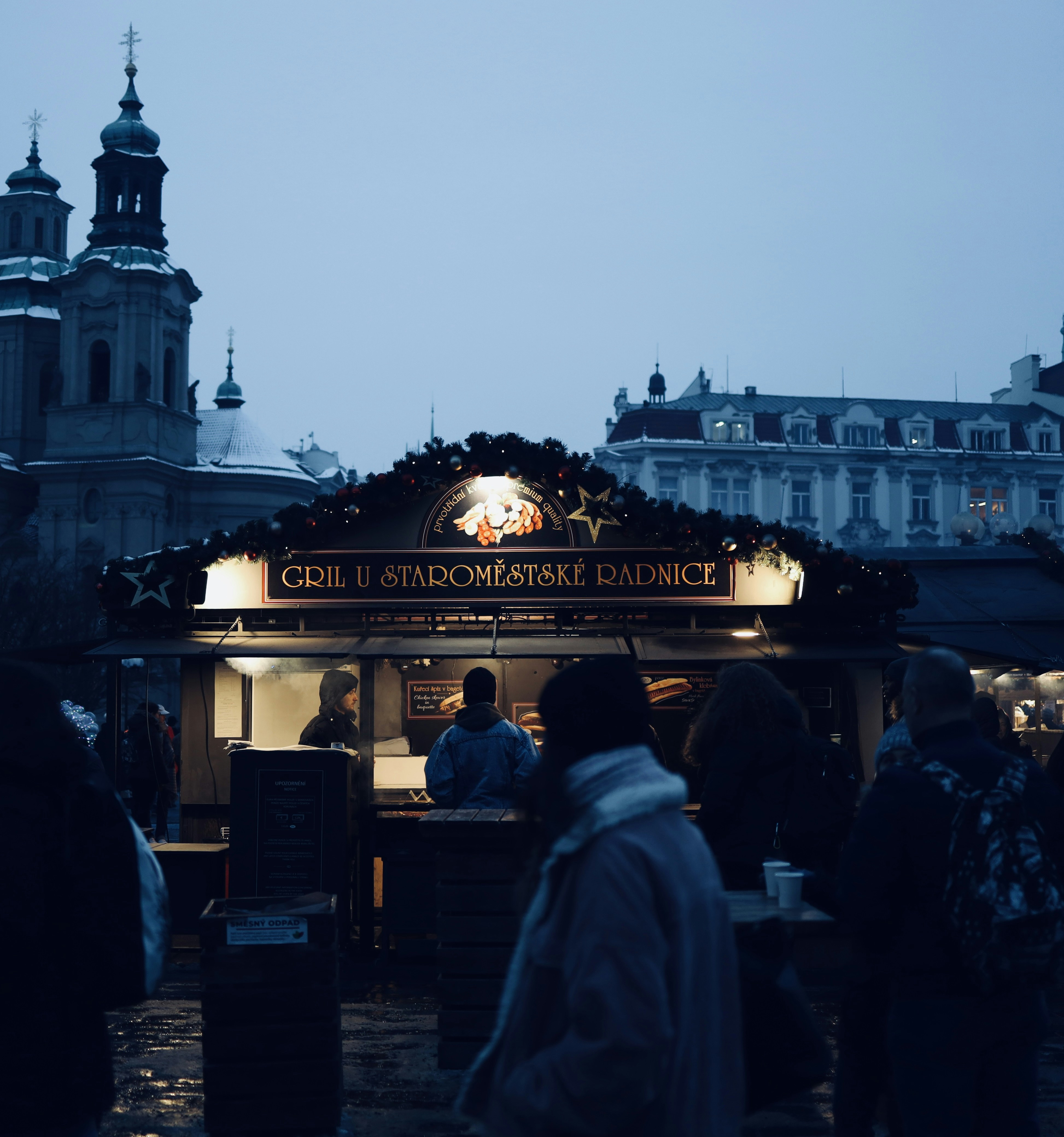 a group of people standing outside of a building