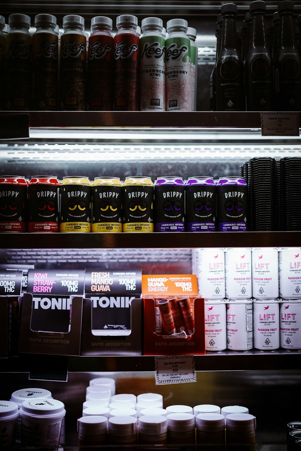 a display case filled with lots of different types of drinks