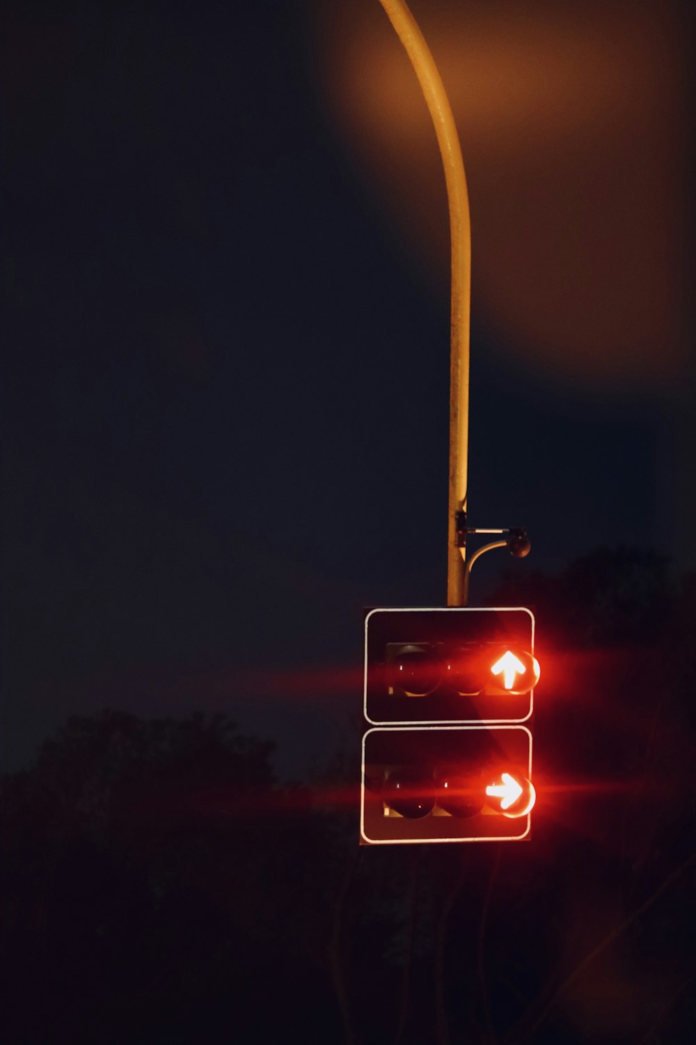a street light with a red light on it