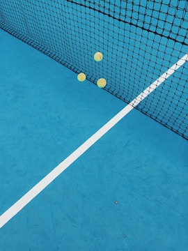 A vibrant tennis court with players in action.