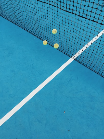 A vibrant tennis court with players in action.