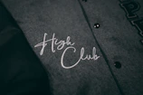 Close-up of a vibrant custom club hoodie with bold logo embroidery.
