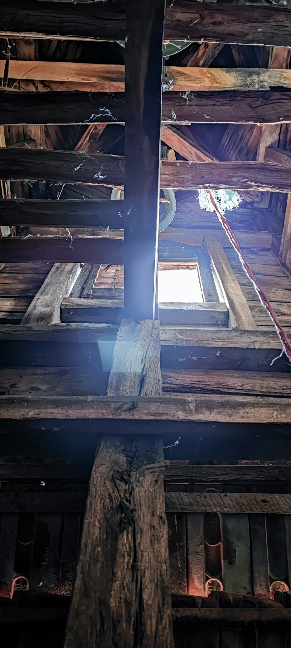 a wooden structure with a window and a beam