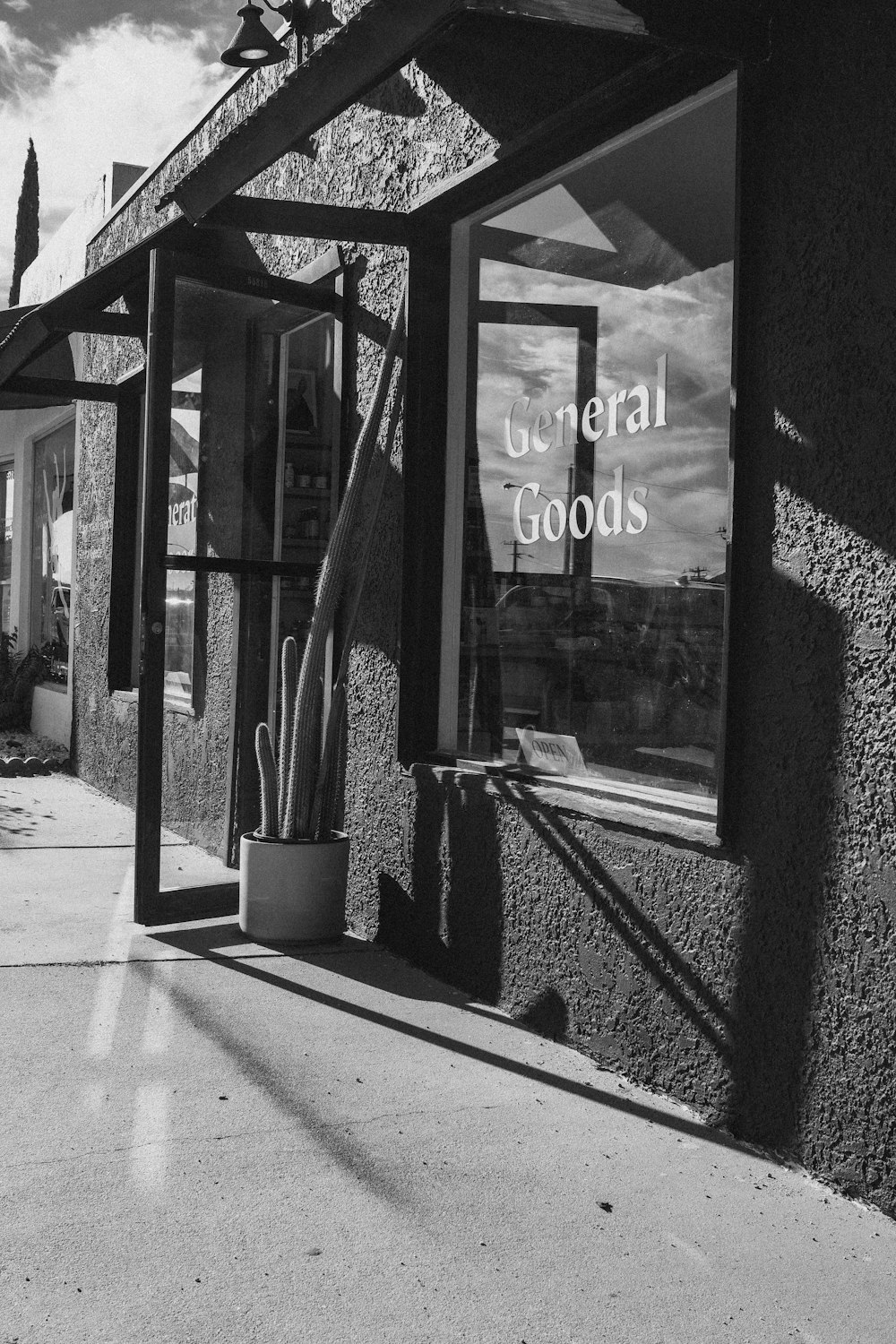 a black and white photo of a store front