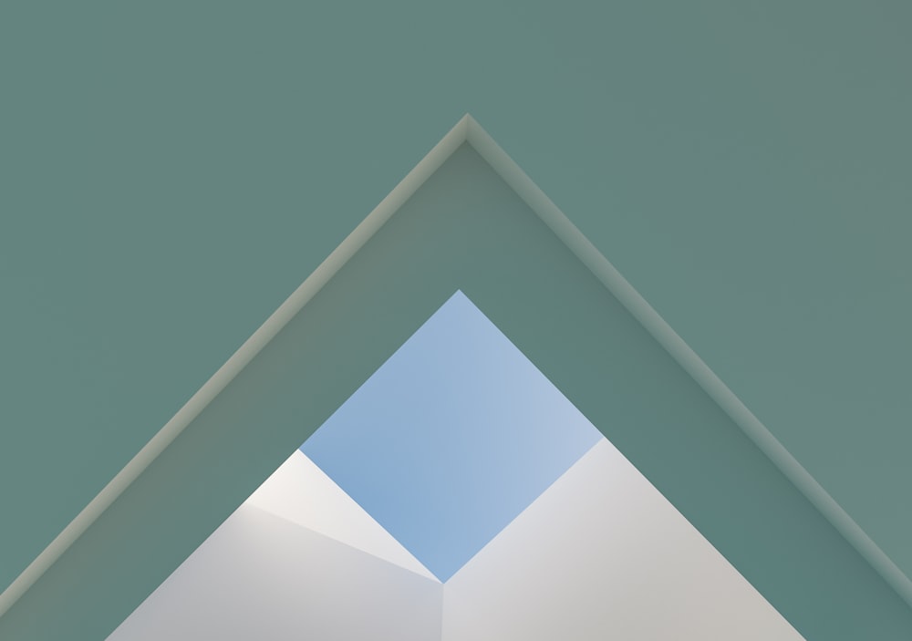 a white triangle with a blue sky in the background