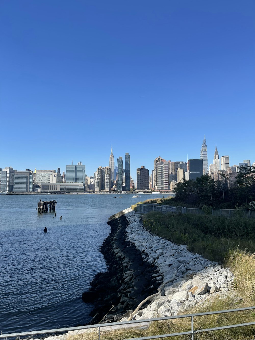 a body of water with a city in the background