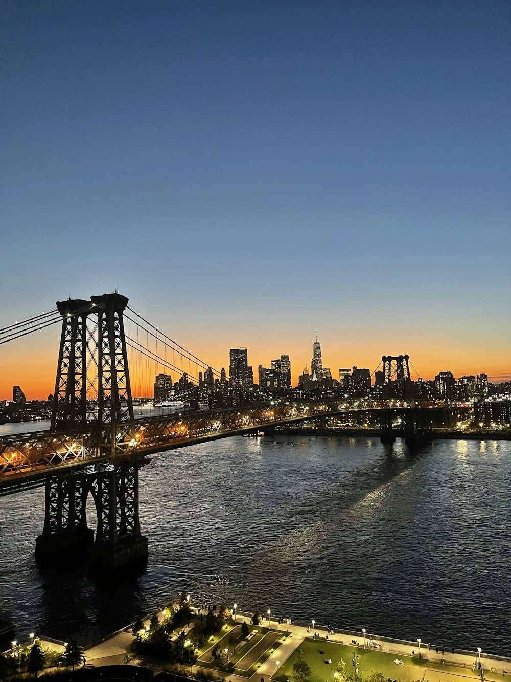 a view of a city and a bridge at night