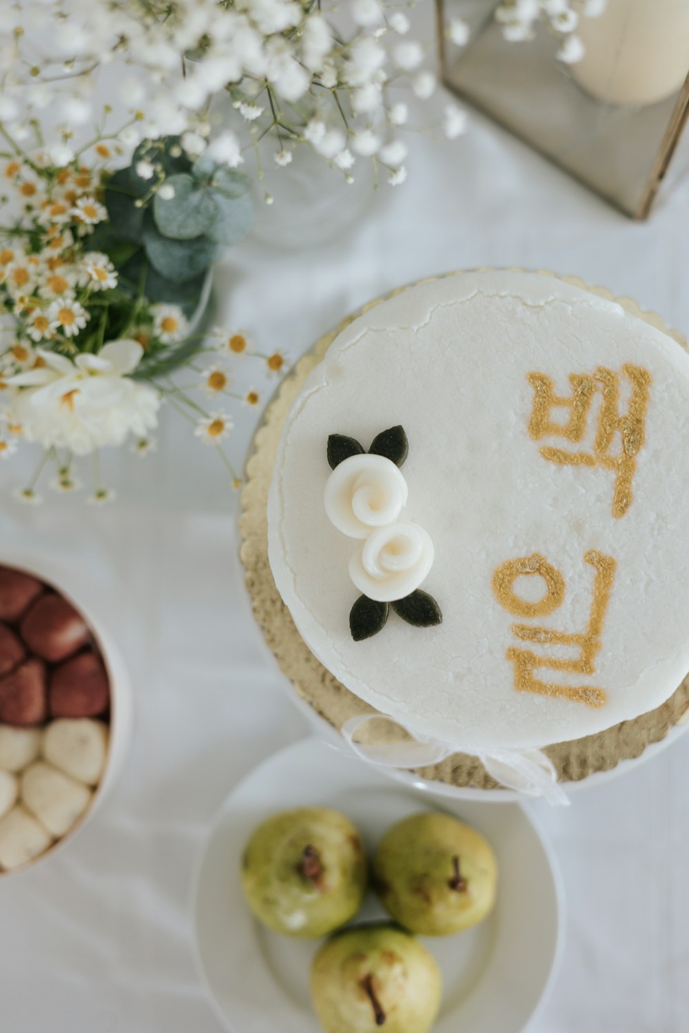 a cake with a flower on it sitting on a table