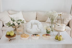 A beautifully arranged table with elegant wedding gifts.