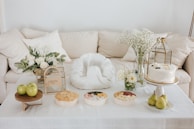 An elegant arrangement of curated gifts displayed on a minimalist wooden table.