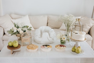 A beautifully arranged table with various gift items and food displays.
