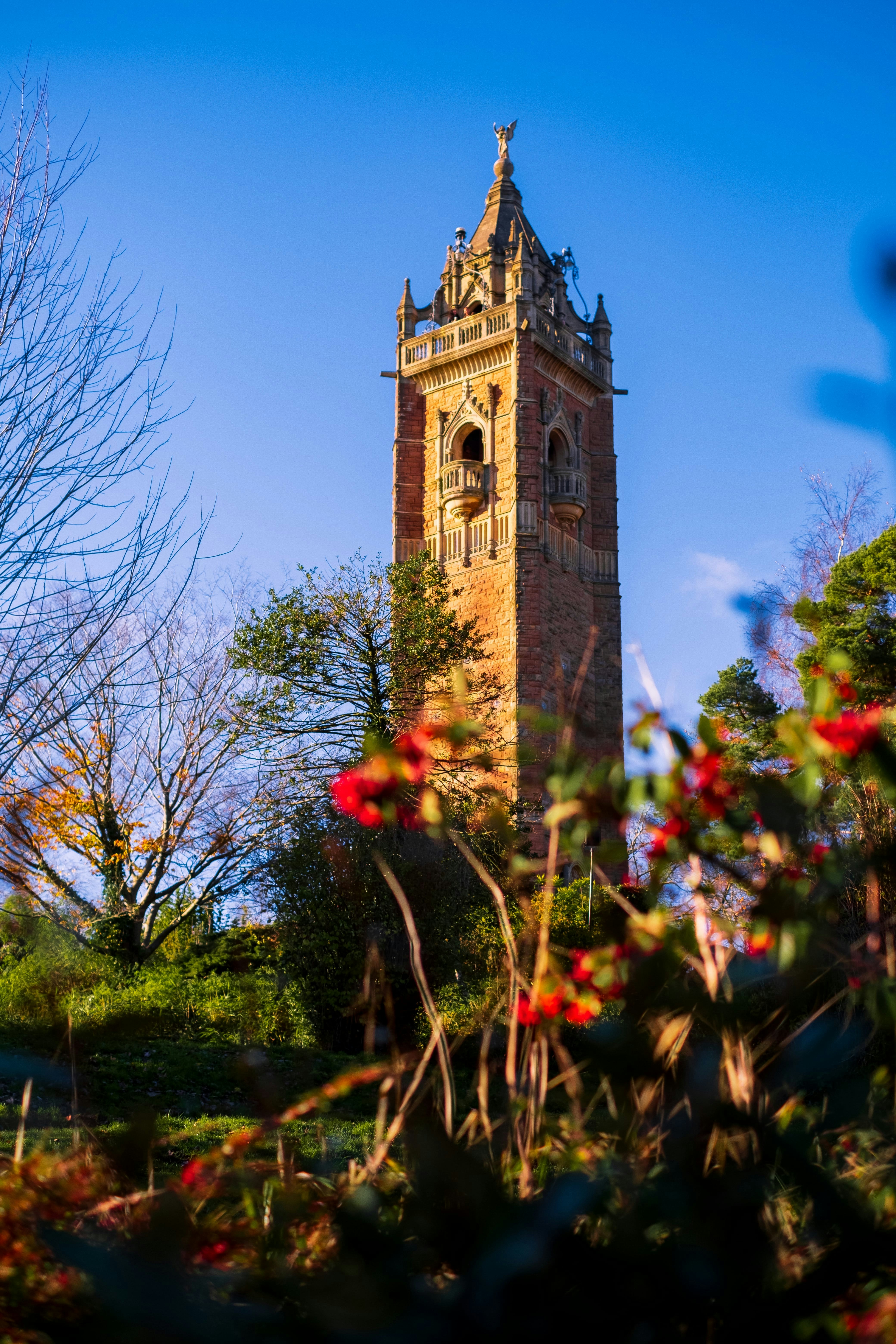 a tall tower with a clock on the top of it