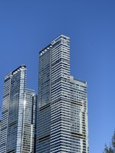 Modern commercial building framework rising against a clear sky.