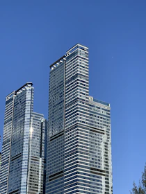 High-rise office buildings in Bangalore with clear blue sky, symbolizing growth.