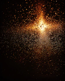 a street light that is shining on a dark background
