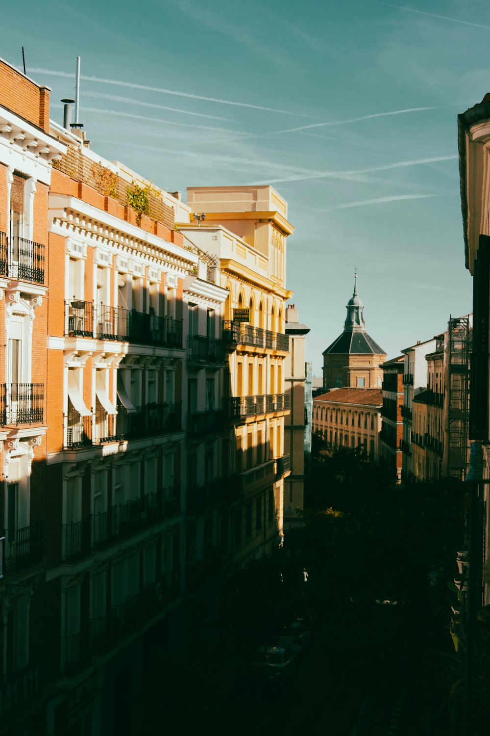 a view of a city with buildings and a clock tower