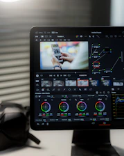 a computer screen with a picture of a person holding a cell phone