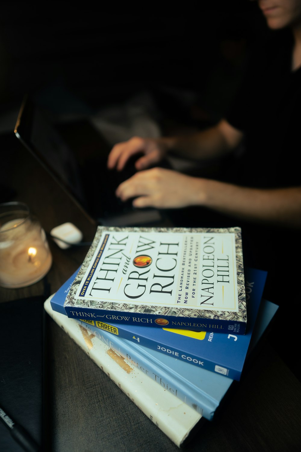 a stack of books sitting on top of a table