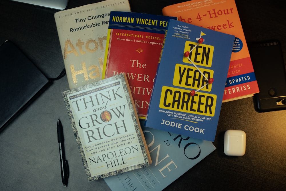 a pile of books sitting on top of a table