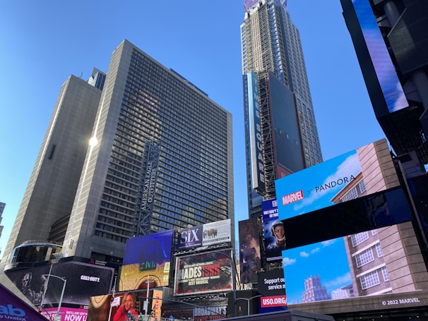 Epic battle scene with heroes and villains clashing amid crumbling skyscrapers.