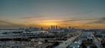 a view of a city at sunset from a tall building