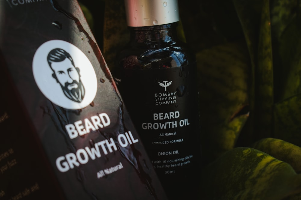 a bottle of beard growth oil next to some bananas