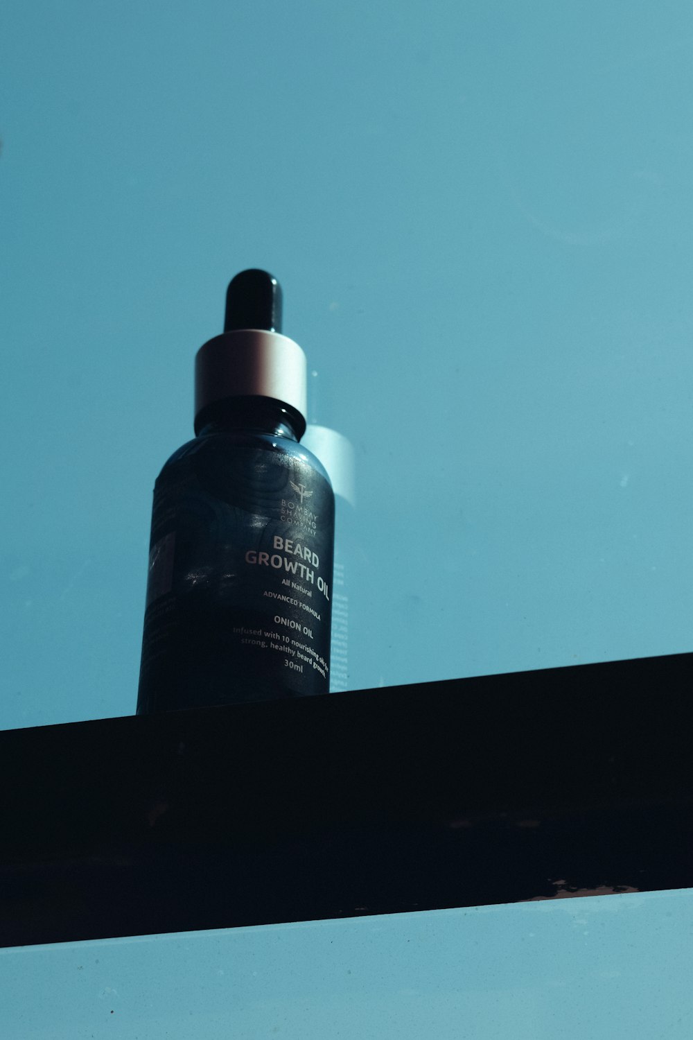 a bottle of water sitting on top of a shelf