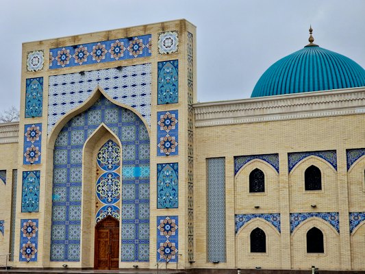 A large building with a blue dome on top of it — Turkistan, Kazakhstan