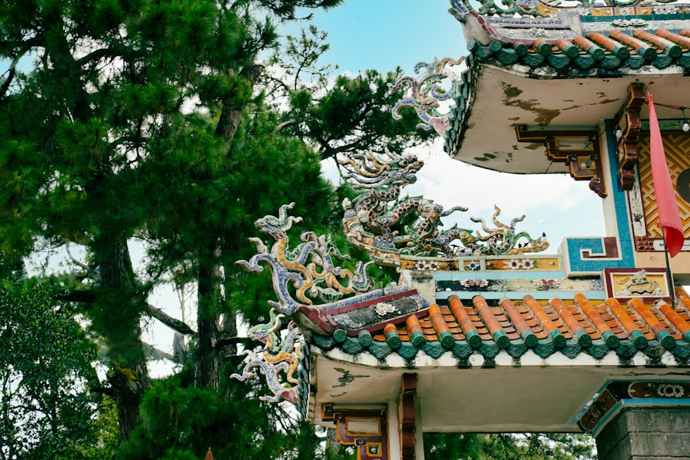 a building with a dragon decoration on the roof