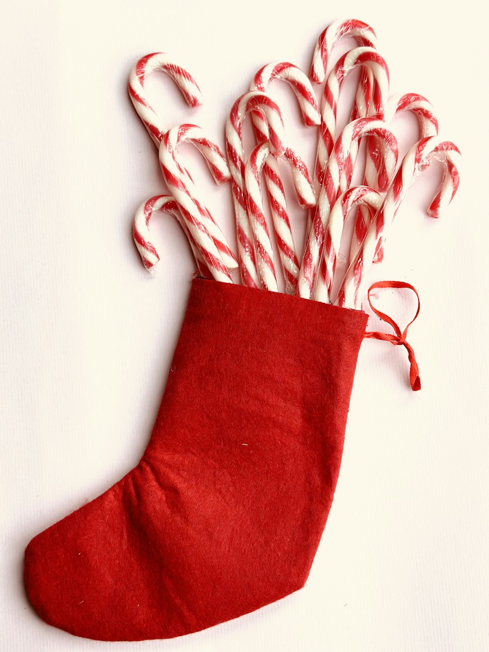 a stocking filled with candy canes sitting on top of a table