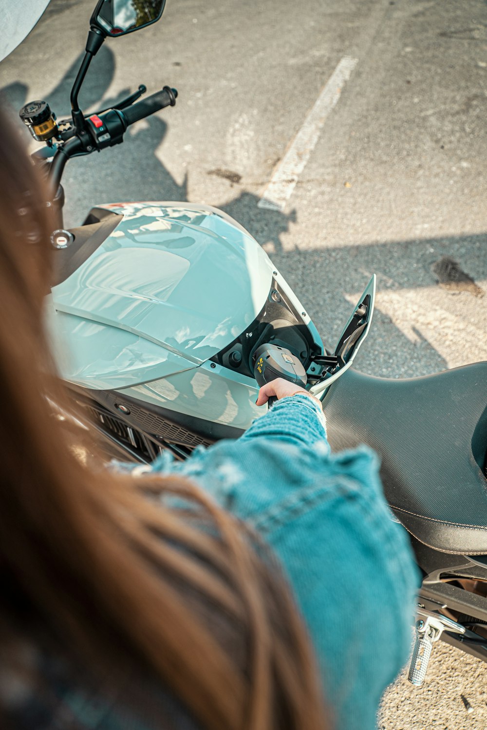 a person riding a motorcycle on a city street